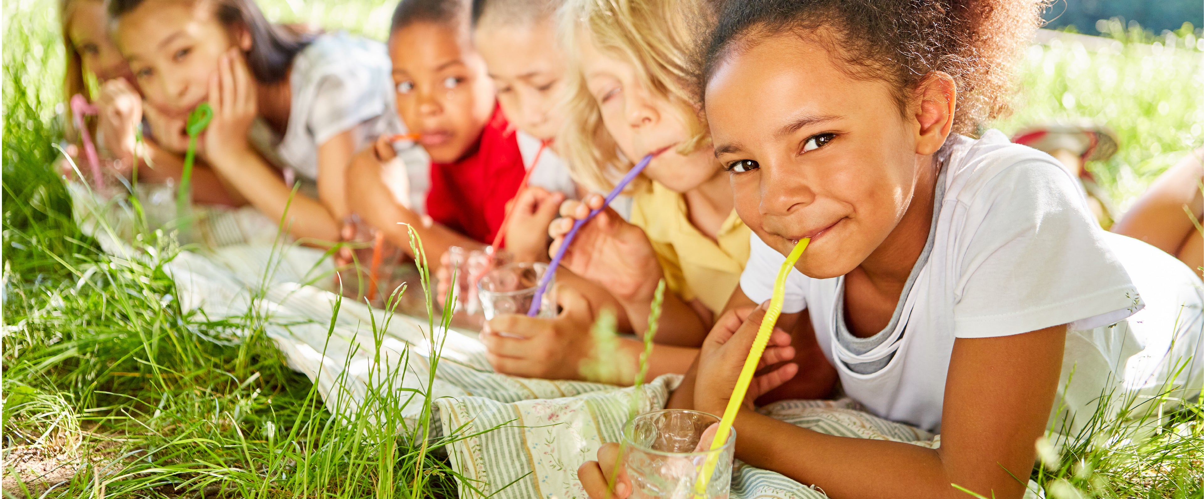 Kids drinking clean, safe water from glasses