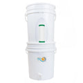 White water bucket filtration system with a visible brand logo with cutout to show nanofiber gravity flow filter on a white background
